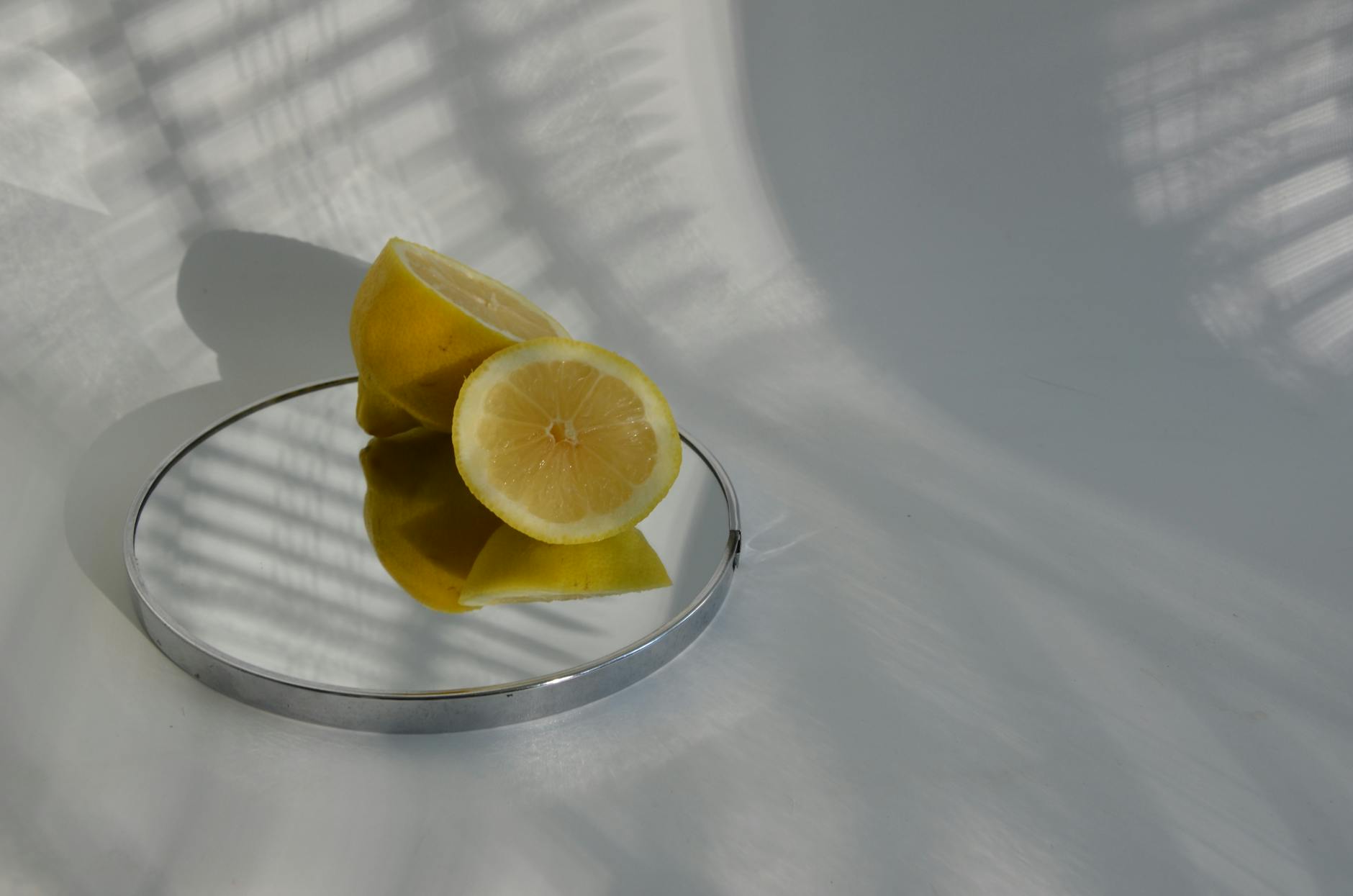 Bright yellow silicone vibrator surrounded by peeled bananas on a vibrant yellow background
